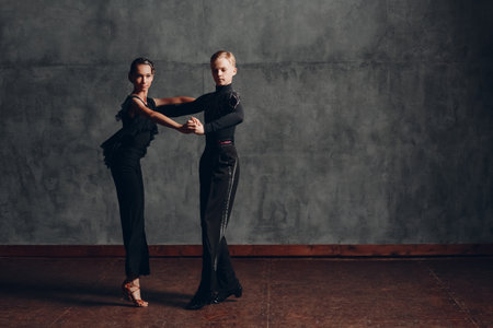 Young couple dancing in ballroom dance Paso doble.の写真素材