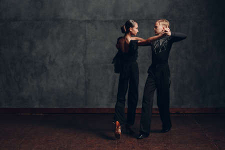 Young couple dancing in ballroom dance Paso doble.の写真素材