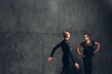 Young couple dancing in ballroom dance Paso doble.の写真素材