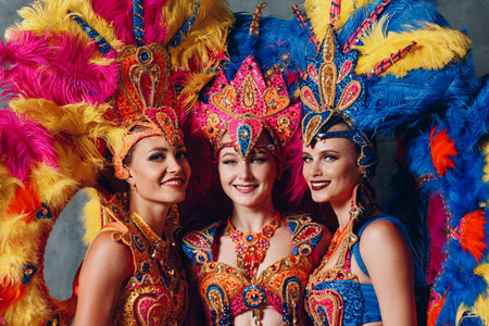 Three Woman in brazilian samba carnival costume with colorful feathers plumage.の写真素材