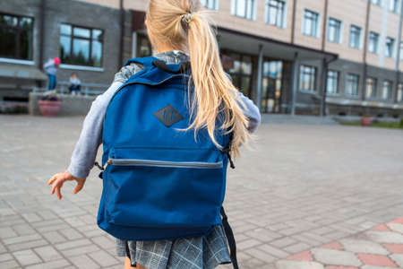 Cute little girl with backpack going back to school.の写真素材