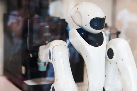 Robot bartender barista prepares coffee in cafe.の写真素材