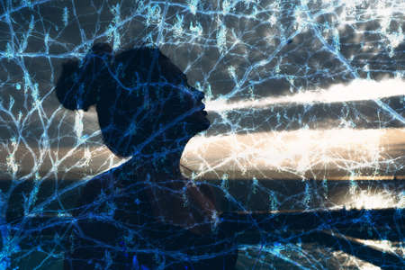 Multiple exposure portrait of woman nature tree branches.の写真素材