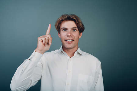Young man pointing and forefinger index finger upの写真素材
