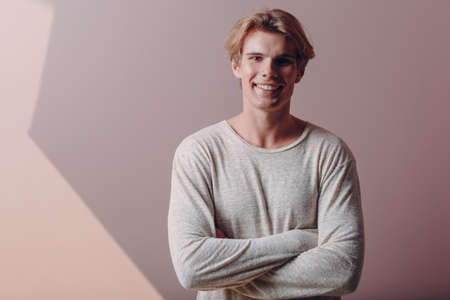 Portrait european young man portrait at studio in face maskの写真素材