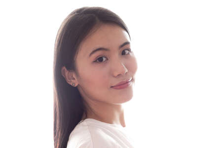 Portrait of asian smiling woman on white background.の写真素材