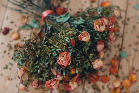 Floor lay withered dry old rose flowers bouquetの写真素材