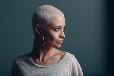 Millenial young woman with short blonde hair portraitの写真素材