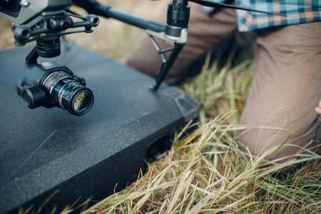 Big quadcopter drone camera lens before aerial flight and filming top view.の写真素材
