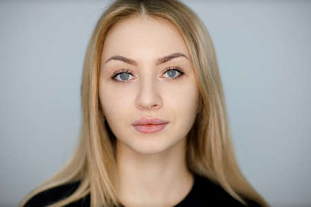 Woman portrait with drawing contour on lip before making lips microblading tattoo procedure.の写真素材