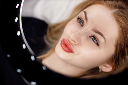 Young woman portrait with pink pigment permanent tattoo lipsの写真素材