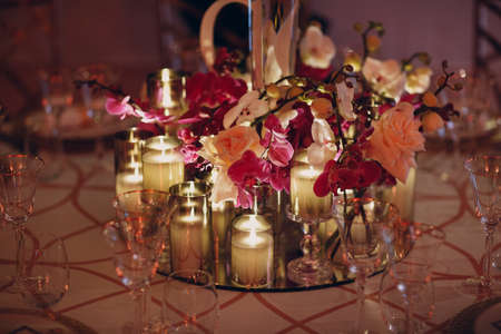 Wedding decor table with white flowers and candles.の写真素材