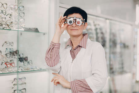 Portrait of an optometrist ophthalmologist middle age adult woman doctorの写真素材