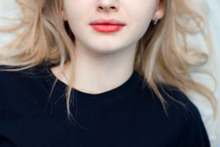 Woman portrait with drawing contour on lips microblading tattoo procedure.の写真素材