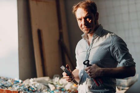 Craftsman male master portrait hold hammer and smalt glass pieces in arm hand for mosaic artwork in...