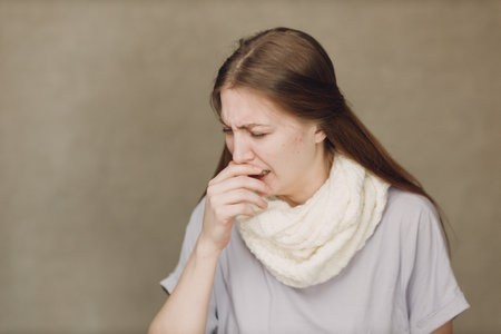 Young woman has cough flu catarrh ill sick disease treatment coldの写真素材