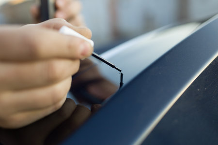 Brush painting small scratches chip car vehicle detailing paintの写真素材