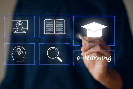 E-learning and Online Education concept. University student learning internet lesson and pointing pen to device screen icon.の写真素材