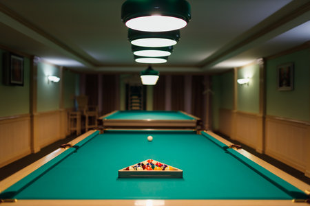 Billiard accessories balls and cue on a billiard table room