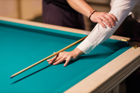 Billiard coach trainer instructor teaches player at billard table or snooker american billiards pool sport gameの写真素材