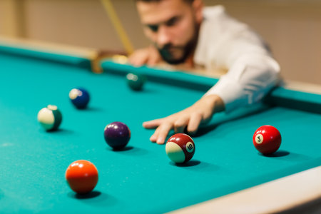 Billiard player aiming at billard table or snooker american billiards pool sport gameの写真素材