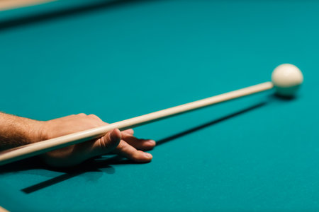 Billiard player calculates the trajectory pathway at billard table or american billiards pool sport...