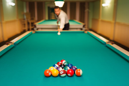 Billiard player at billard table or snooker american billiards pool sport gameの写真素材