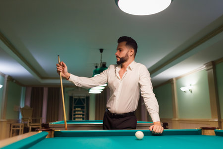 Billiard player at billard table or snooker american billiards pool sport gameの写真素材
