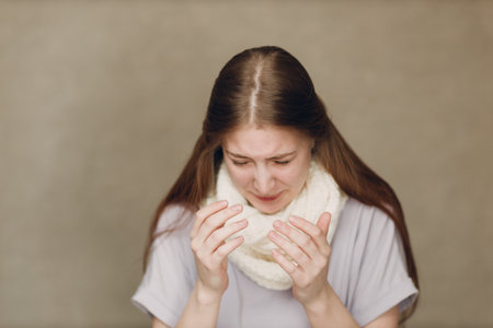 Young woman sneeze has flu catarrh ill sick disease treatment coldの写真素材