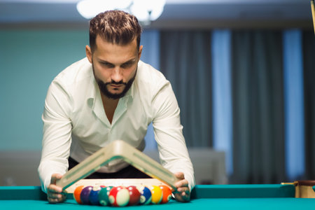 Billiard player preparing billard table or snooker american billiards pool sport gameの写真素材