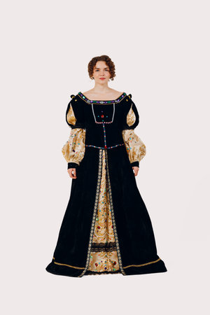 Portrait of a young aristocratic woman dressed in a medieval dress on white background. Front viewの写真素材