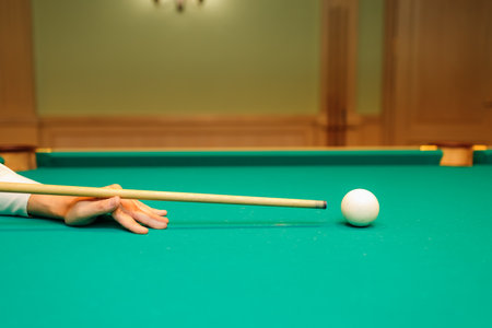 Billiard player aiming at billard table or snooker american billiards pool sport gameの写真素材
