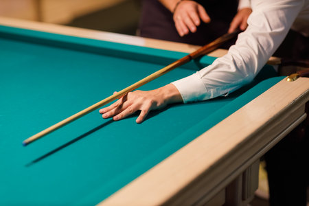 Billiard coach trainer instructor teaches player at billard table or snooker american billiards pool...