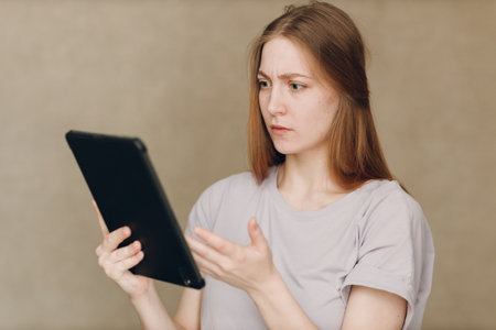 Portrait of young student actress learning role woman with digital tablet. Acting test casting film movie acting auditions.の写真素材
