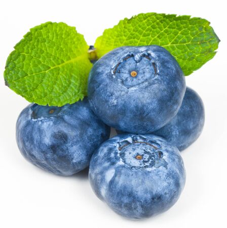 Blueberries with green leaves on a white backgroundの写真素材