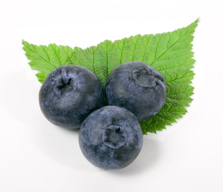 Blueberry with green leaf on white backgroundの写真素材