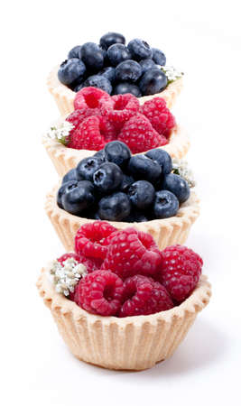 Raspberries and blueberry and blueberries in a waffle basketの写真素材