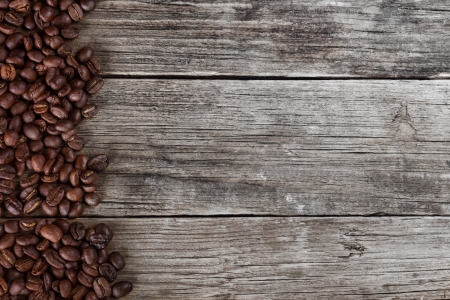 Coffee beans on wood texture backgroundの写真素材