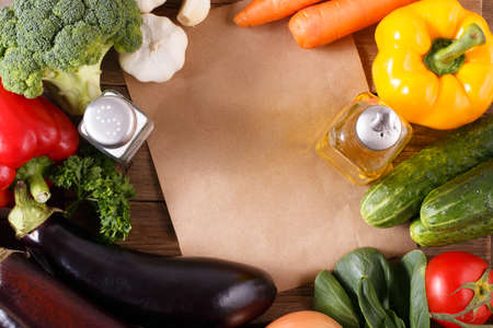 Vegetables on wood background with space for recipe. Organic food.の写真素材