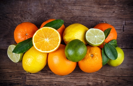 Fruits on wood texture background with space for text. Organic food.の写真素材