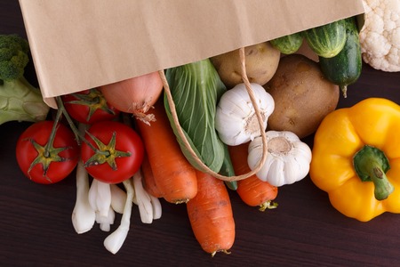 Vegetables on wood background with space for recipe. Organic food.の写真素材