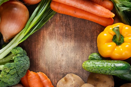 Vegetables on wood background with space for text. Organic food.の写真素材