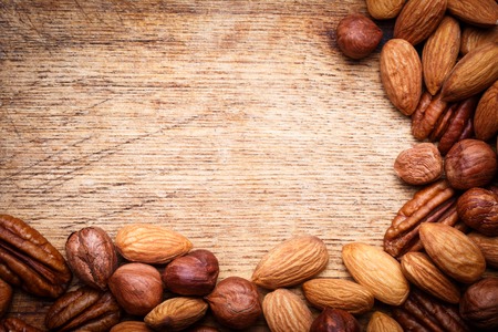 Background texture of assorted mixed nuts including cashew nuts, pecan nuts, almondsの写真素材