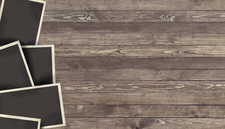 Photo frame on wooden background for design or montageの写真素材