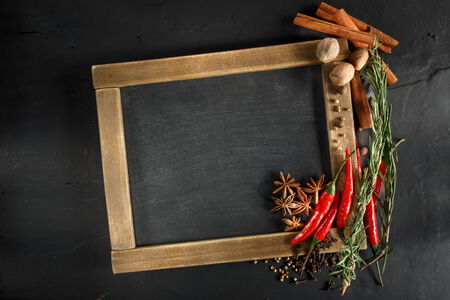 Herbs and spices with chalk board for text or recipes.の写真素材