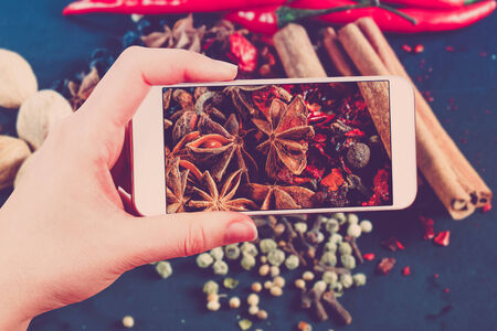 Using smartphones to take photos of herbs and spices. の写真素材