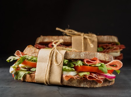 Handmade sandwich with bacon on dark backgroundの写真素材