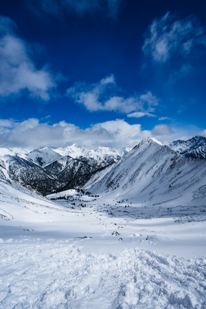 Winter landscape of mountains. Snow-covered mountains. Beautiful mountain landscape.の写真素材
