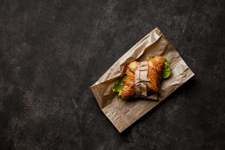 Freshly baked croissant on stone background. Overhead viewの写真素材