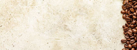 Line concrete background with coffee beans on scratched table textureの写真素材